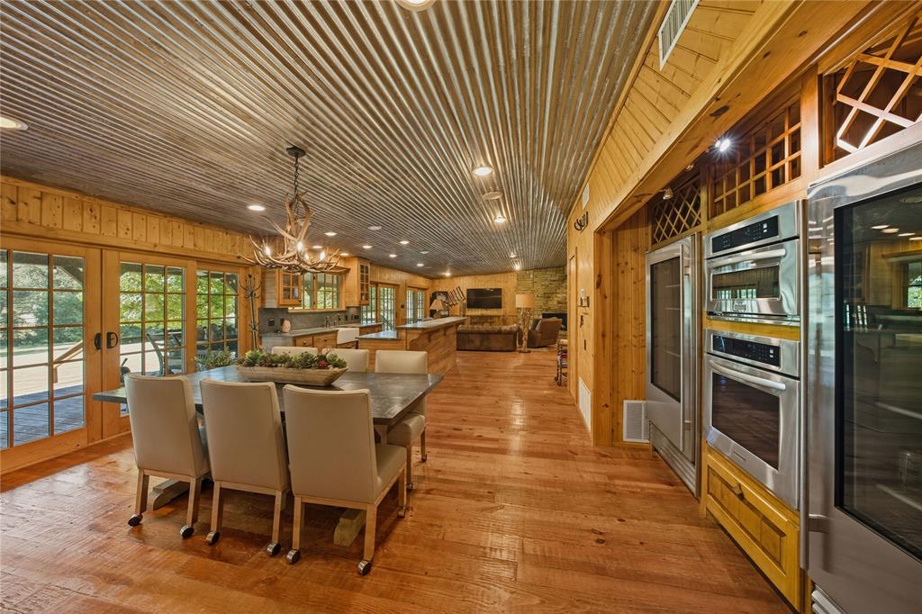 100 Letha Road Trinidad, TX 75163 - Photo 9 of 38 a dining hall with stainless steel appliances granite countertop a table chairs and couches