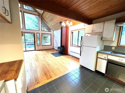 a view of a room with wooden floor and window