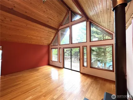 a view of a kitchen with wooden floor and a sink