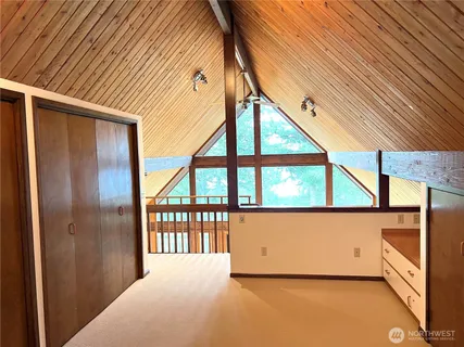 a view of a balcony with chairs