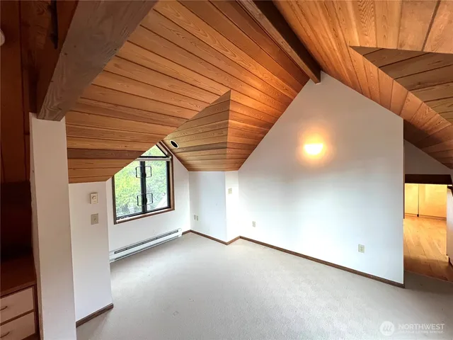 a view of a room with wooden walls