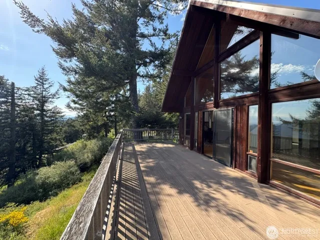 a view of a balcony with wooden floor