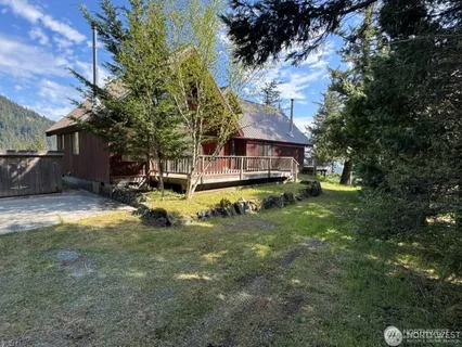 a view of front door and porch with a floor to ceiling window