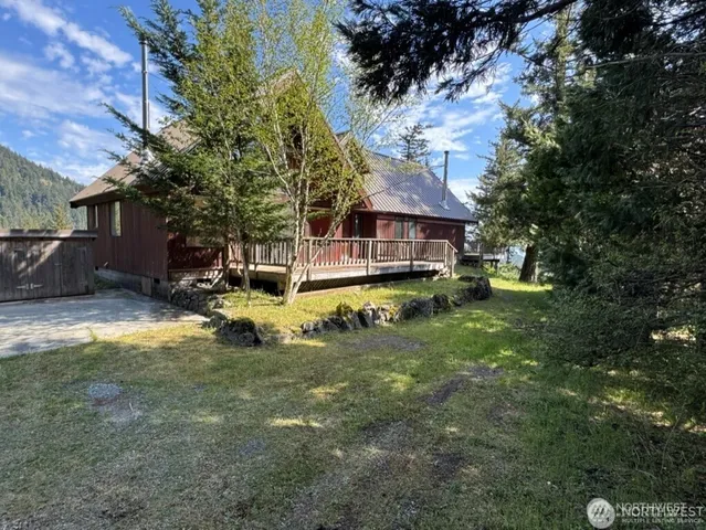 a view of front door and porch with a floor to ceiling window