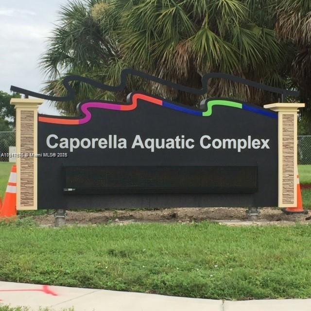 9247 Chambers Street Tamarac, FL 33321 - Photo 12 of 16 a view of outdoor space with sign board