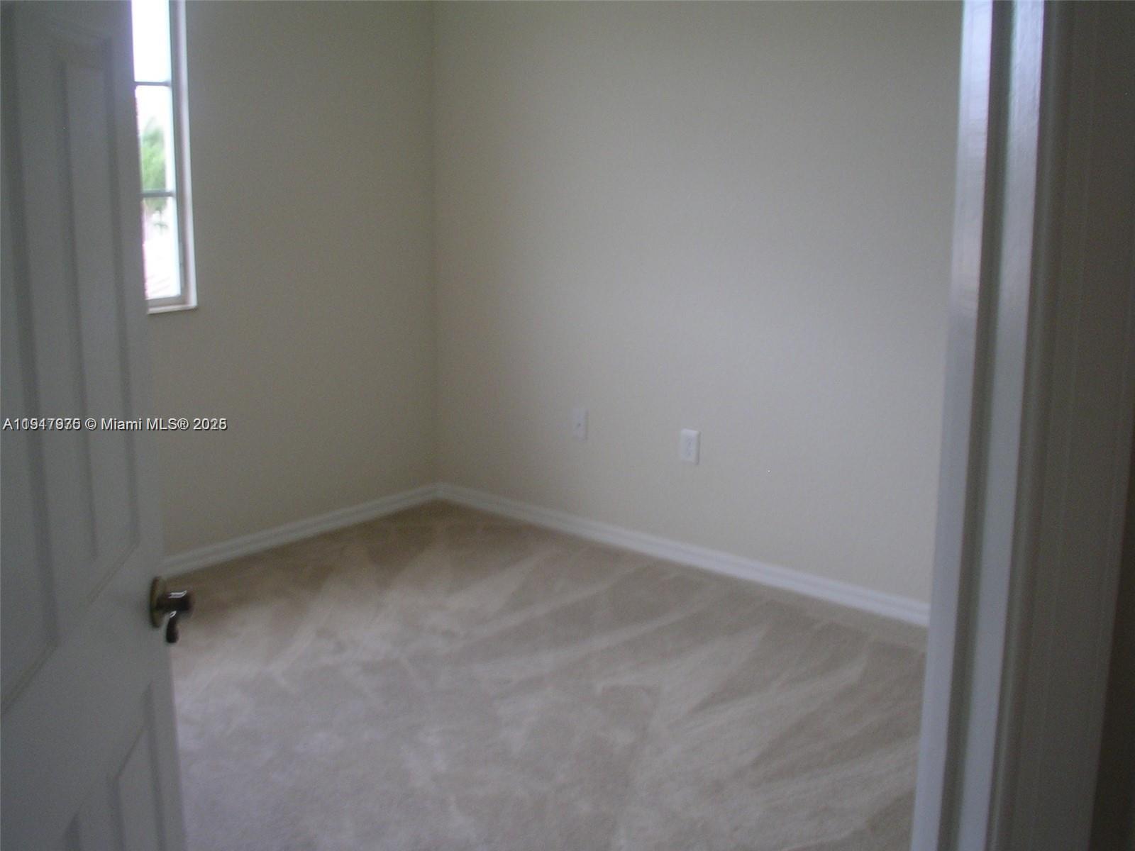 9247 Chambers Street Tamarac, FL 33321 - Photo 6 of 16 a small space with a window
