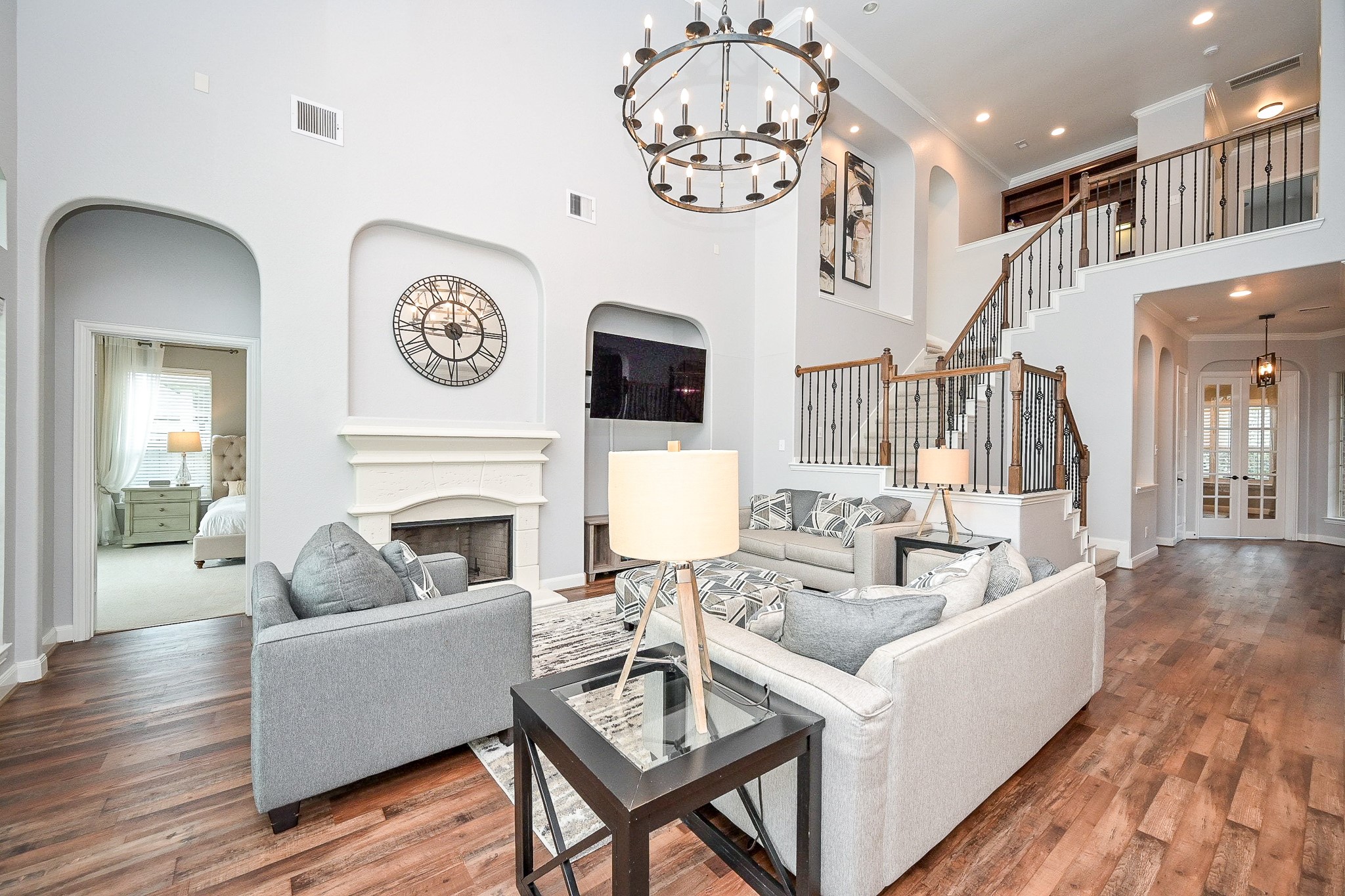 11 South Victoriana Circle Spring, TX 77389 - Photo 16 of 38 a living room with furniture a fireplace and a chandelier