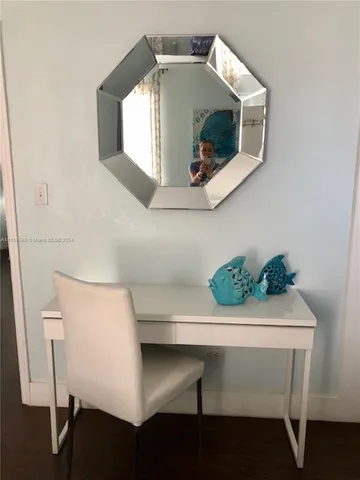 a view of living room with furniture and a flat screen tv