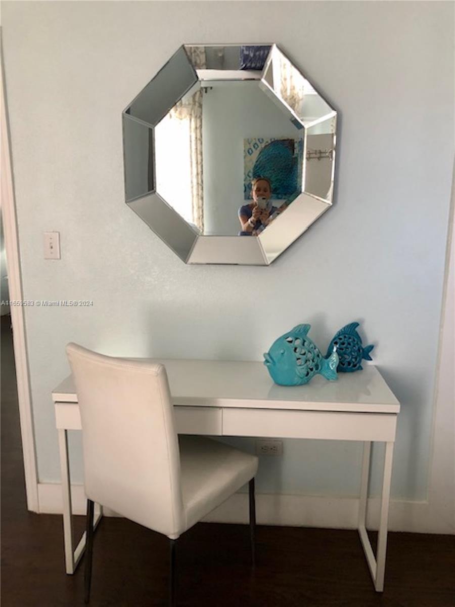 3030 Collins Avenue, Unit 3E Miami Beach, FL 33140 - Photo 6 of 20 a view of living room with furniture and a flat screen tv