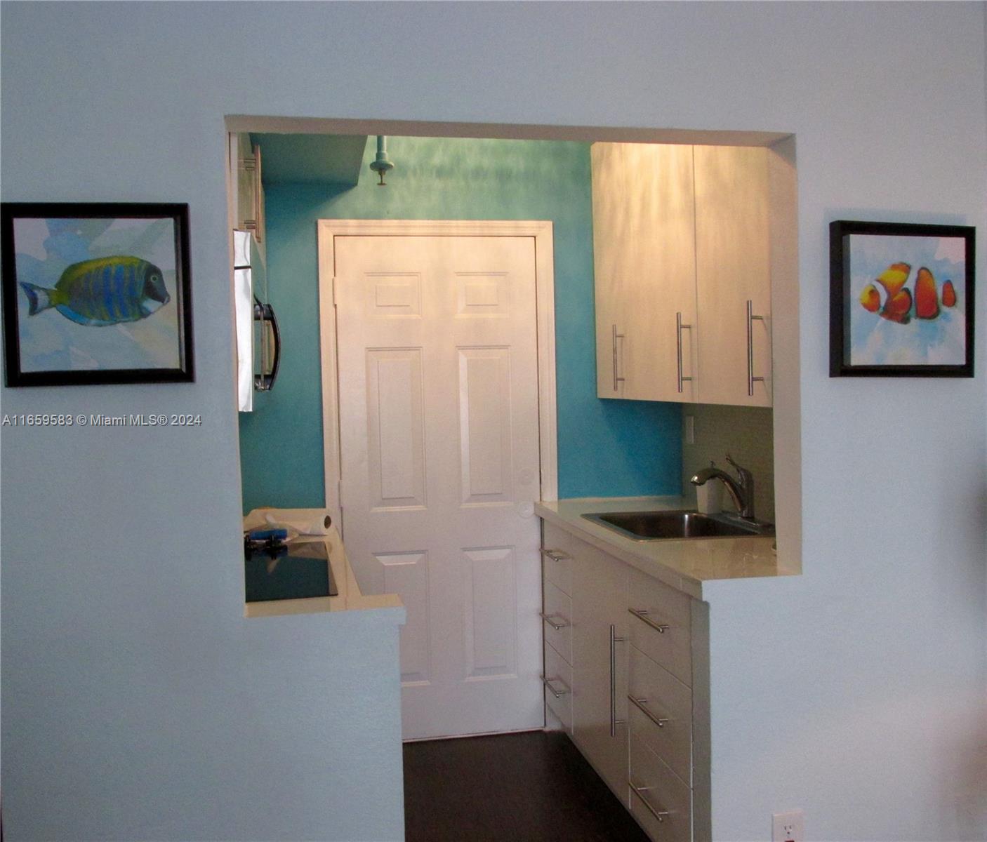 3030 Collins Avenue, Unit 3E Miami Beach, FL 33140 - Photo 7 of 20 a room with cabinets and dust bin