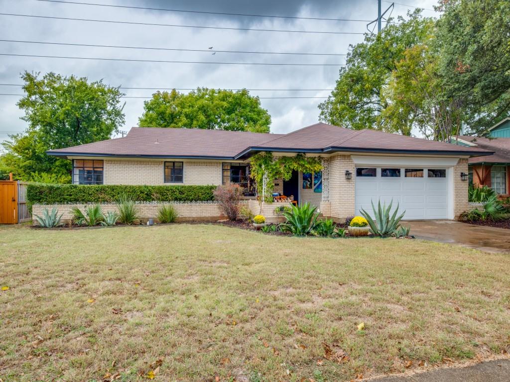 9753 Carnegie Drive Dallas, TX 75228 - Photo 1 of 25 a front view of a house with a garden