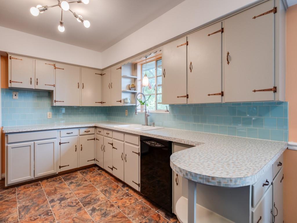 9753 Carnegie Drive Dallas, TX 75228 - Photo 15 of 25 a kitchen with granite countertop a sink stainless steel appliances and cabinets