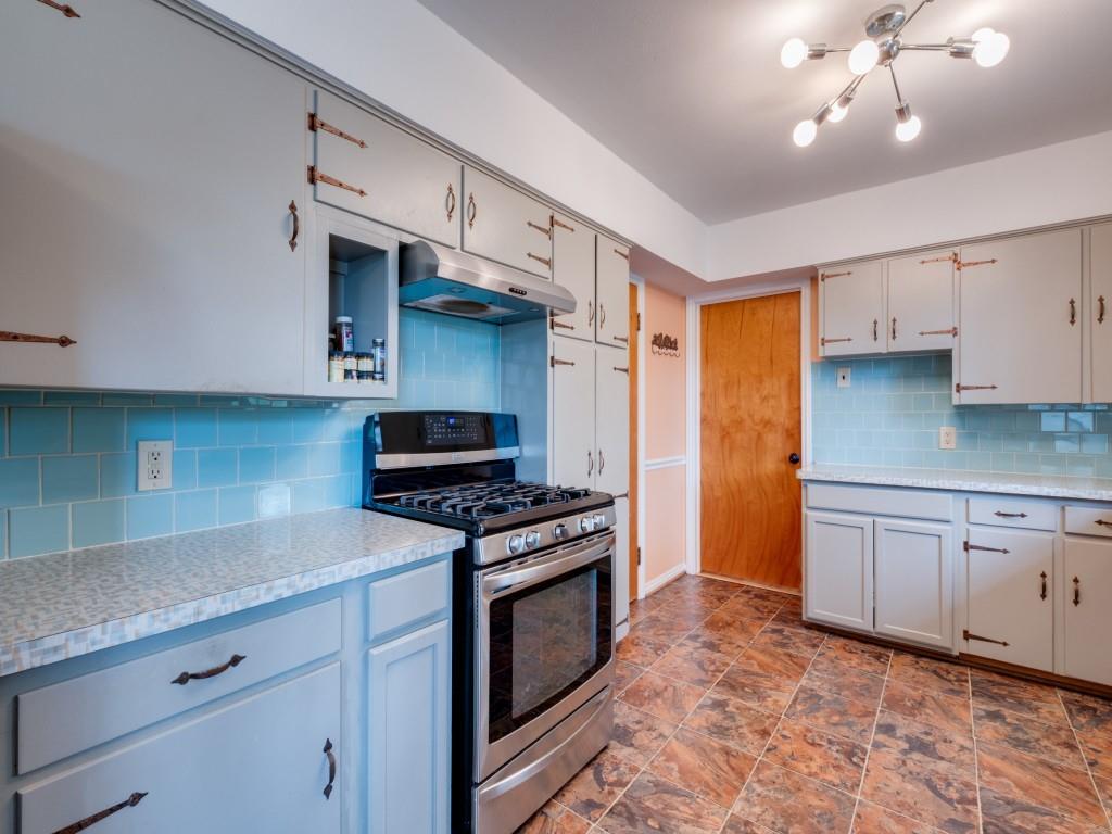 9753 Carnegie Drive Dallas, TX 75228 - Photo 16 of 25 a kitchen with stainless steel appliances granite countertop a stove a sink dishwasher and a refrigerator