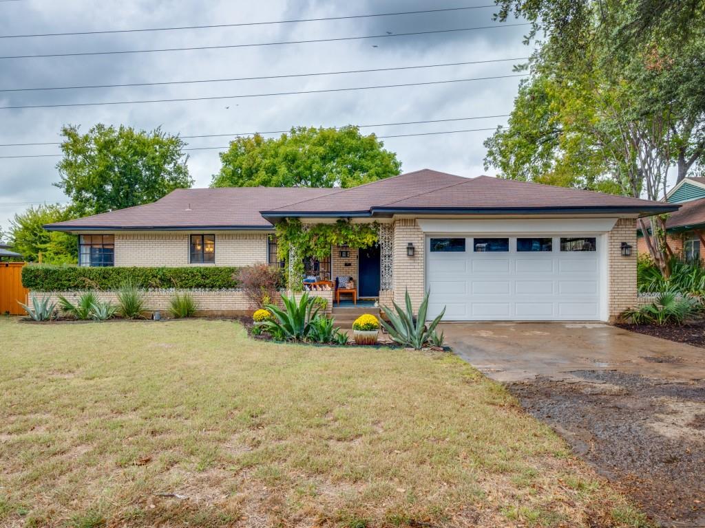 9753 Carnegie Drive Dallas, TX 75228 - Photo 2 of 25 a front view of a house with a yard and potted plants