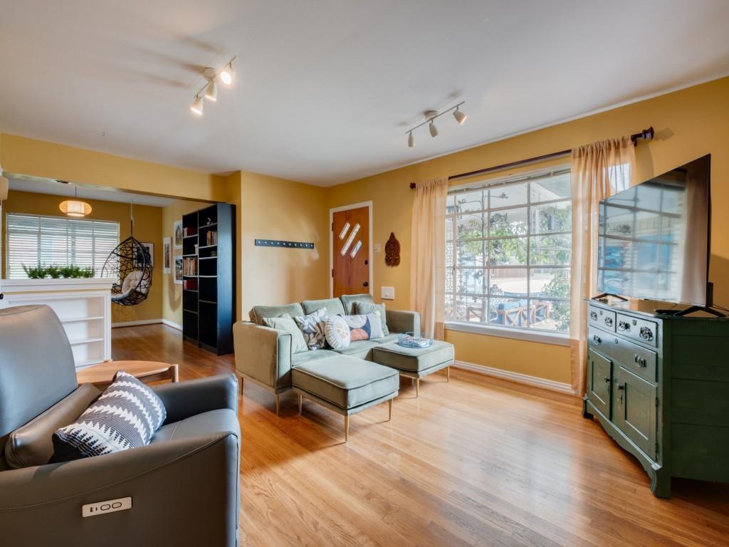 9753 Carnegie Drive Dallas, TX 75228 - Photo 4 of 25 a living room with furniture and a large window