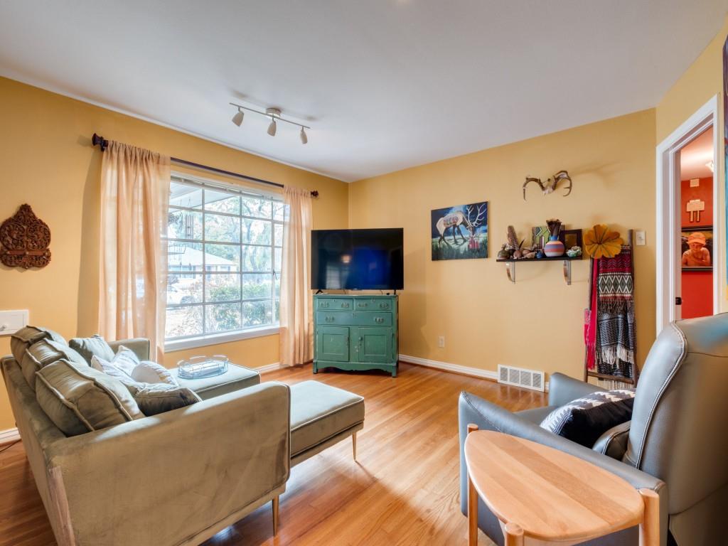 9753 Carnegie Drive Dallas, TX 75228 - Photo 5 of 25 a living room with furniture and a flat screen tv