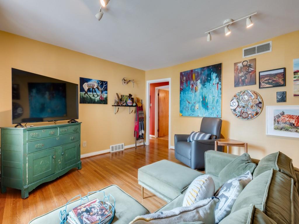 9753 Carnegie Drive Dallas, TX 75228 - Photo 6 of 25 a living room with furniture and a flat screen tv