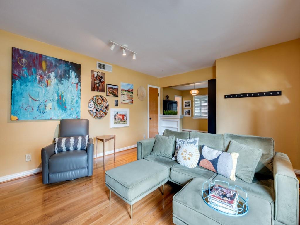 9753 Carnegie Drive Dallas, TX 75228 - Photo 7 of 25 a living room with furniture and a wooden floor