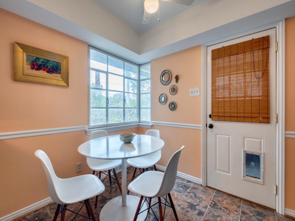 9753 Carnegie Drive Dallas, TX 75228 - Photo 10 of 25 a view of a dining room with furniture and a window