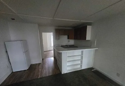 a room with cabinets and wooden floor