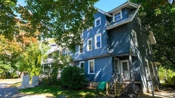 a view of a house with a tree