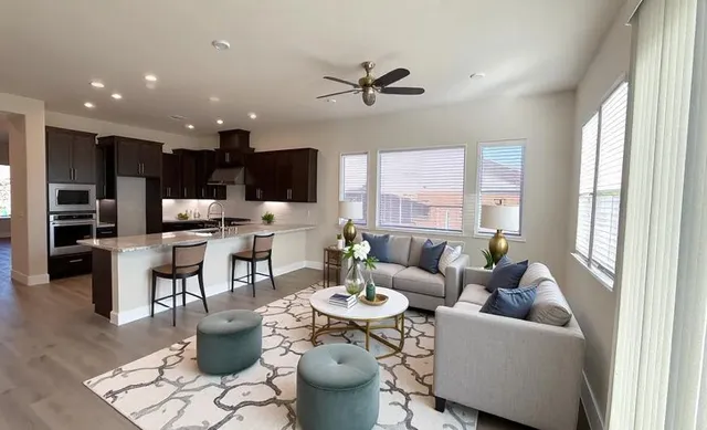 a living room with furniture and a large window