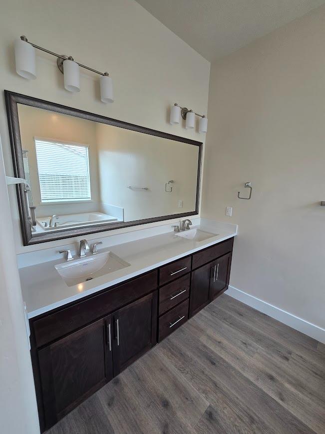 5526 Kamala Way Fair Oaks, CA 95628 - Photo 8 of 10 a bathroom with a double vanity sink and mirror