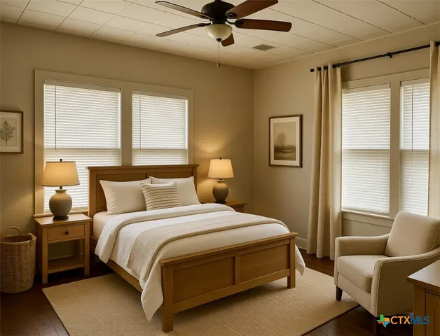 a bedroom with bed and window