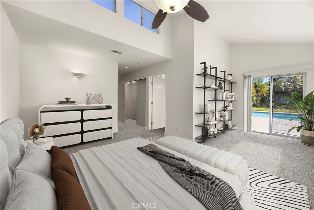 24582 Corta Cresta Drive Lake Forest, CA 92630 - Photo 13 of 26 a spacious bedroom with a bed and a large window