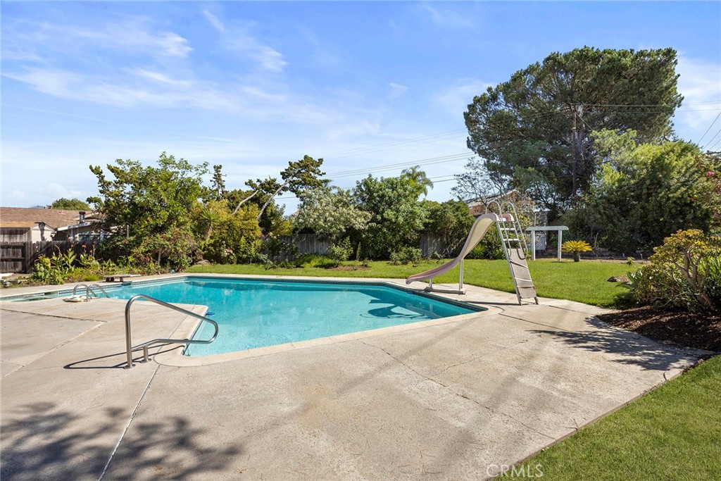 24582 Corta Cresta Drive Lake Forest, CA 92630 - Photo 21 of 26 a view of a swimming pool with an outdoor space and seating area