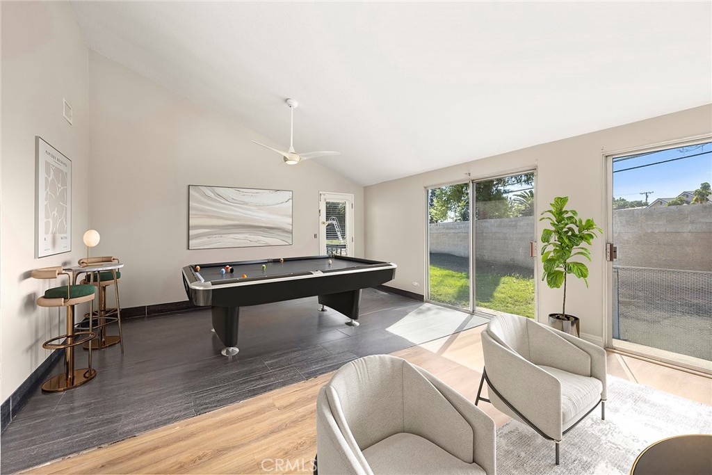 24582 Corta Cresta Drive Lake Forest, CA 92630 - Photo 7 of 26 a living room with furniture a rug and a potted plant