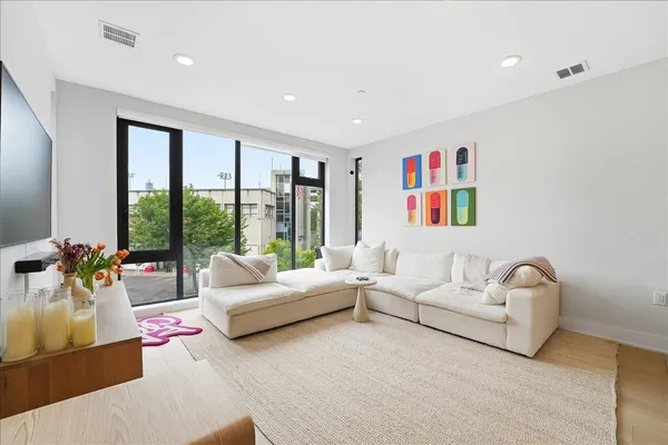 a living room with furniture and a large window