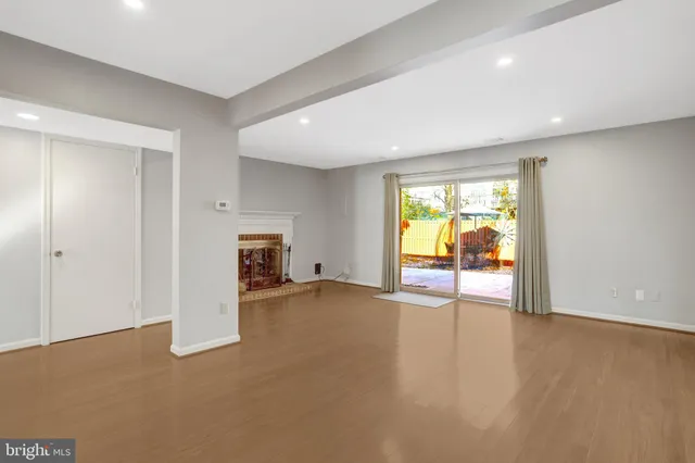a view of a room with window and a kitchen