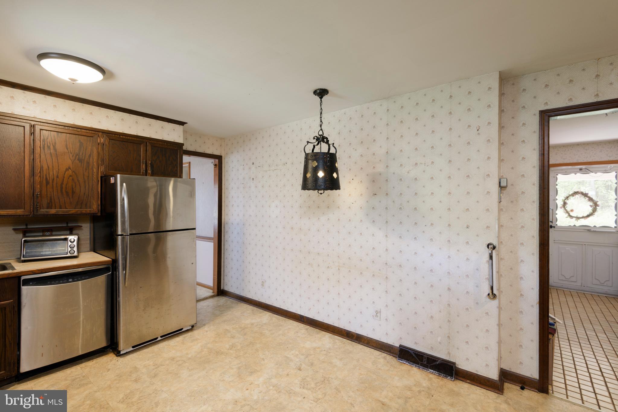 3463 Garnet Mine Road Garnet Valley, PA 19060 - Photo 11 of 38 a kitchen with a refrigerator and a refrigerator