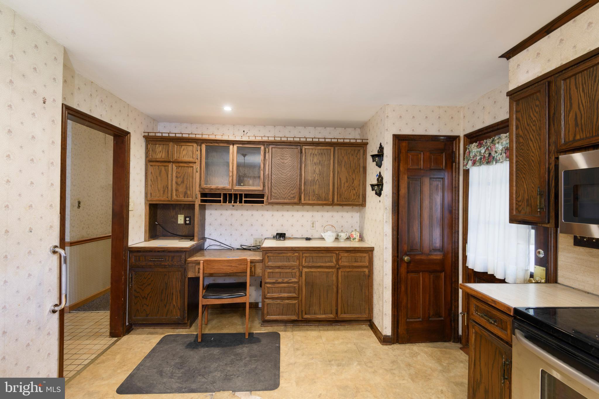 3463 Garnet Mine Road Garnet Valley, PA 19060 - Photo 12 of 38 a kitchen with stainless steel appliances a refrigerator and a stove top oven