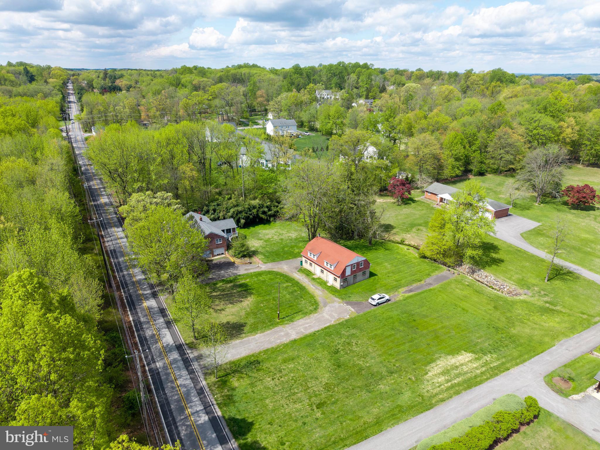 3463 Garnet Mine Road Garnet Valley, PA 19060 - Photo 31 of 38 a view of a lush green outdoor space with a lake view