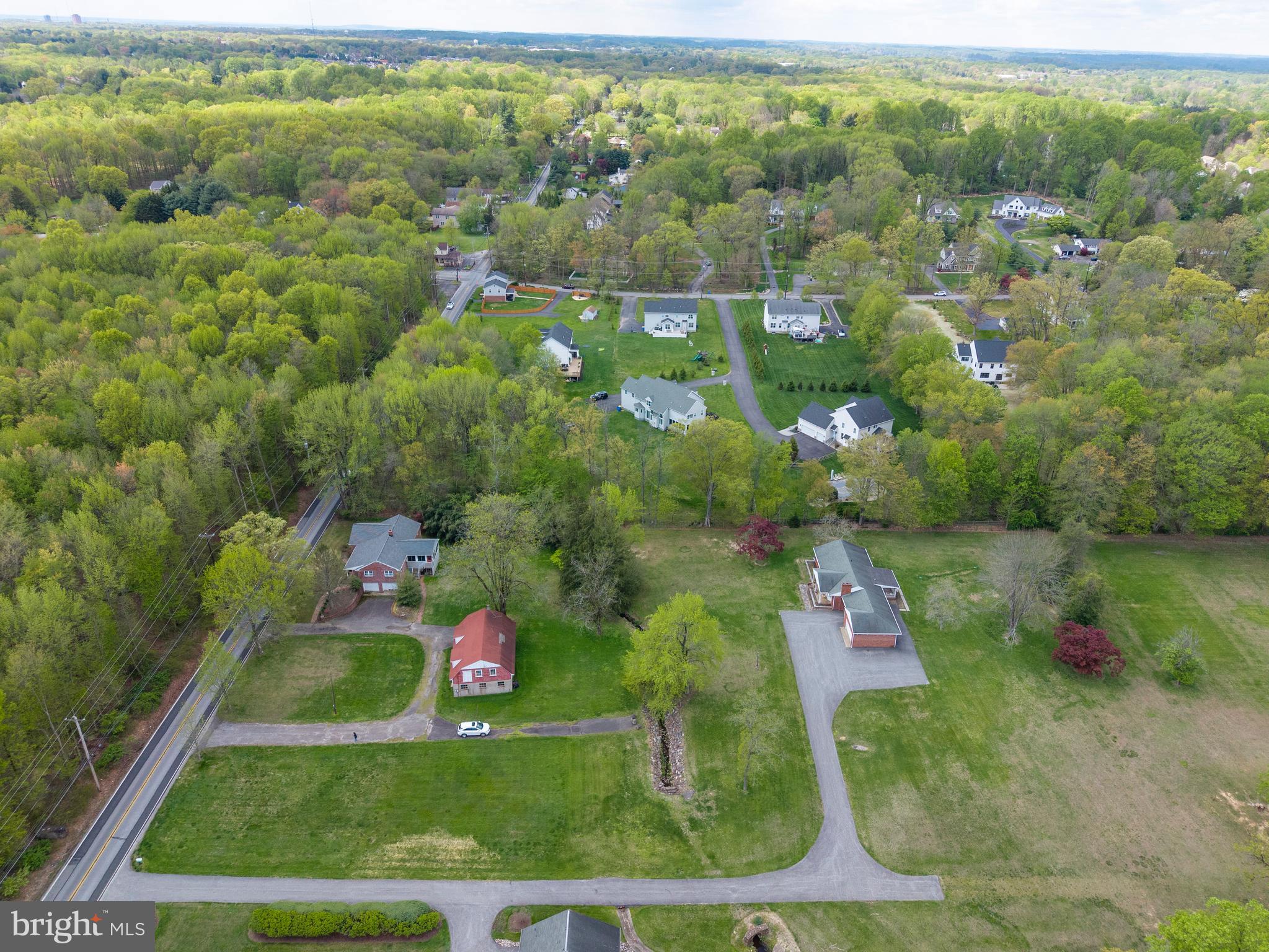 3463 Garnet Mine Road Garnet Valley, PA 19060 - Photo 36 of 38 an aerial view of residential houses with outdoor space and trees
