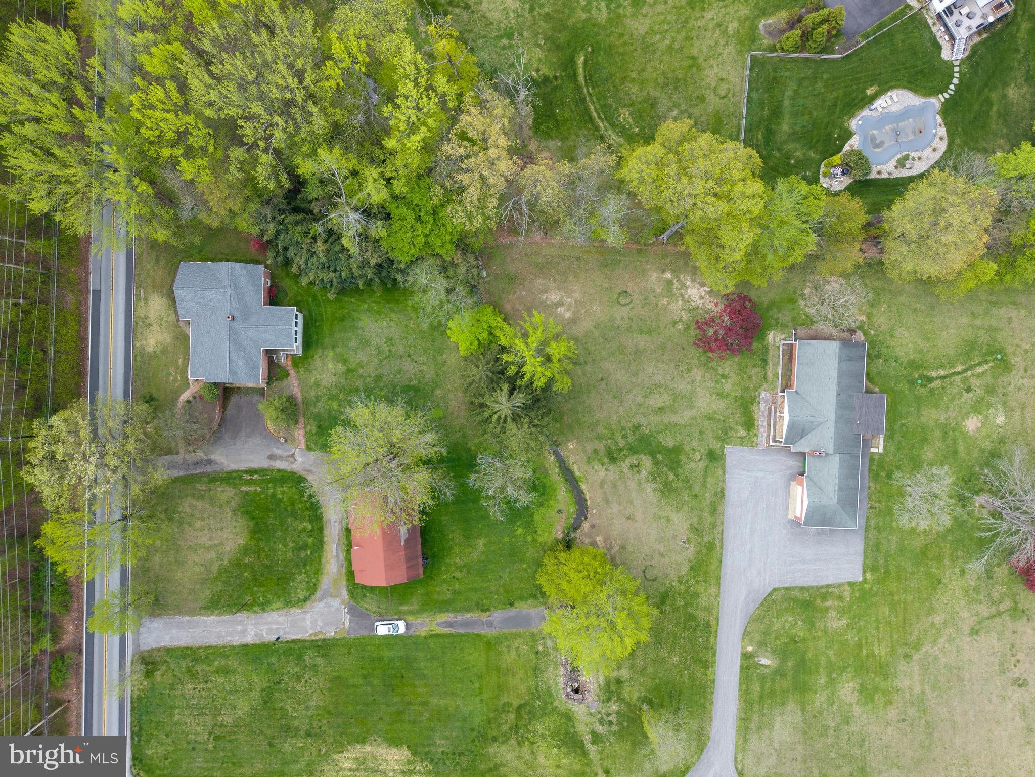 3463 Garnet Mine Road Garnet Valley, PA 19060 - Photo 37 of 38 an aerial view of a house with a yard
