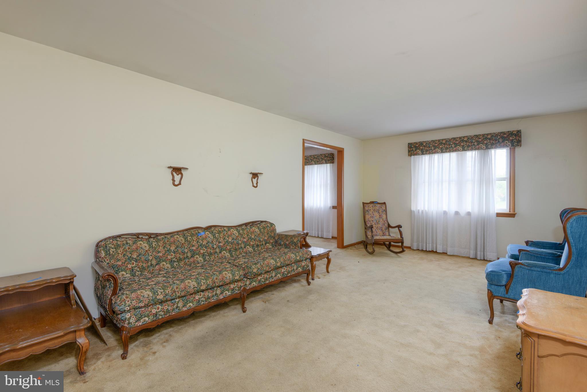 3463 Garnet Mine Road Garnet Valley, PA 19060 - Photo 6 of 38 a living room with furniture gym equipment and a window