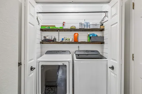 a utility room with washer and dryer