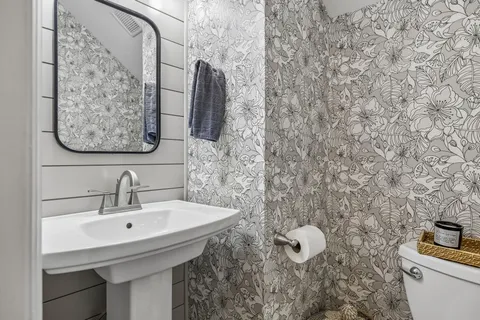 a bathroom with a sink and mirror