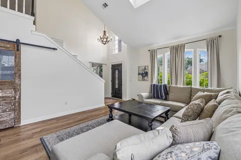 a living room with furniture and windows