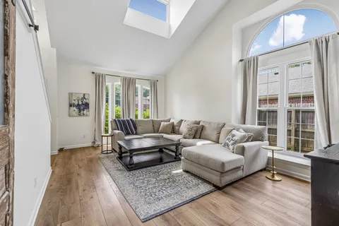 a living room with furniture and a rug
