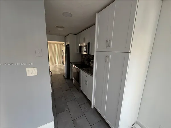a hallway with cabinets