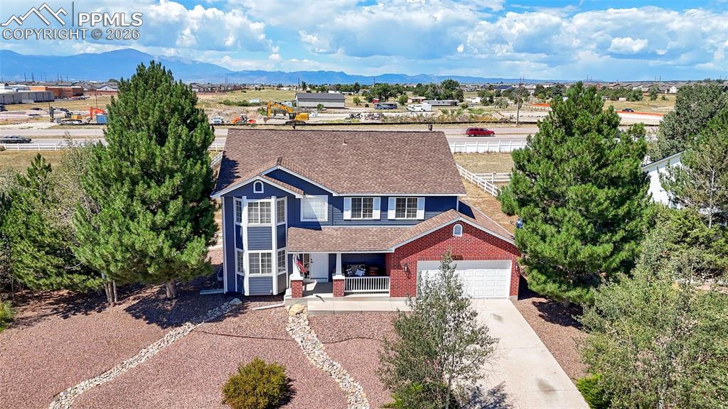 7636 Bullet Road Peyton, CO 80831 - Photo 1 of 30 a aerial view of a house next to a yard