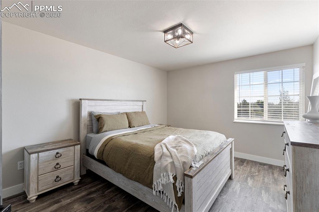 7636 Bullet Road Peyton, CO 80831 - Photo 15 of 30 a bedroom with a bed and a window
