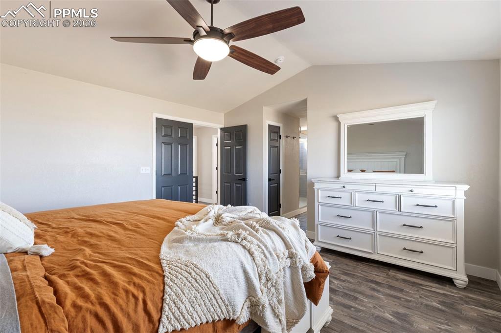 7636 Bullet Road Peyton, CO 80831 - Photo 16 of 30 a bedroom with a bed and a mirror on the dresser