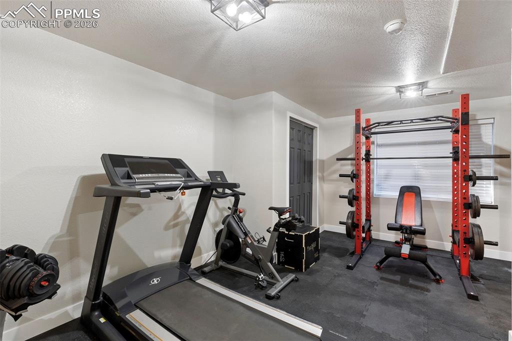 7636 Bullet Road Peyton, CO 80831 - Photo 22 of 30 a view of a room with gym equipment