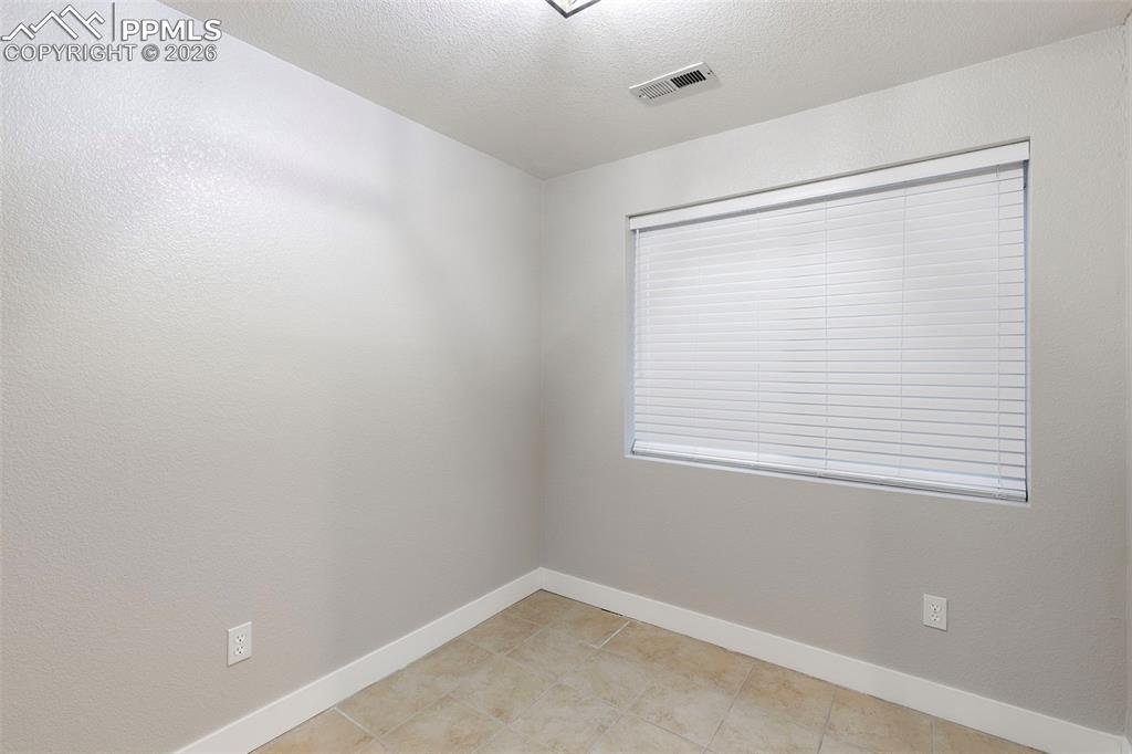 7636 Bullet Road Peyton, CO 80831 - Photo 24 of 30 an empty room with a window