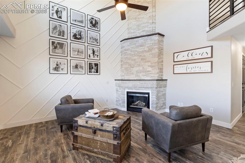 7636 Bullet Road Peyton, CO 80831 - Photo 4 of 30 a living room with furniture and a fireplace